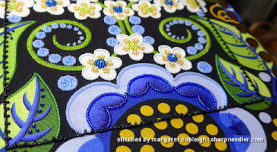 Outlining thread painted petals with beads using a beading koma (Wild Child Japanese Bead Embroidery by Mary Alice Sinton)