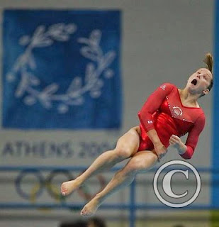 female gymnast doing back flip