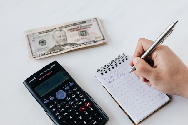 https://www.pexels.com/photo/crop-anonymous-financier-planning-budget-writing-numbers-in-notebook-4386339/