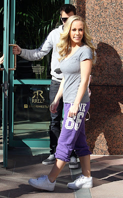 Kendra Wilkinson arriving at an office building with her assistant