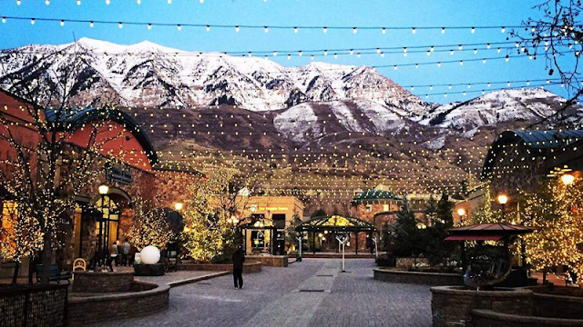 lights hanging across an open-air shopping center