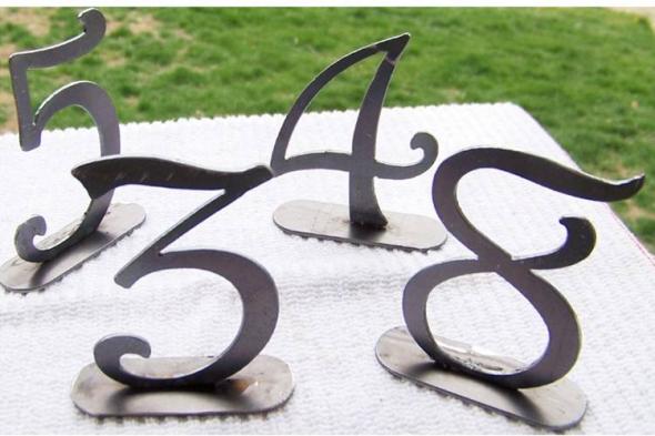 green and purple wedding table numbers and names