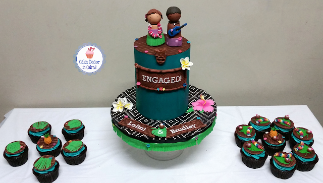 Teal Chocolate Ganache Cake Fondant Frangipannis Hibiscus Grass skirt Pineapple Coconuts Tiki Mask Mats