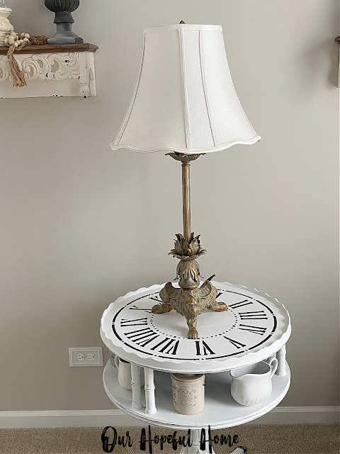 romantic French inspired lamp with white shade on clock table