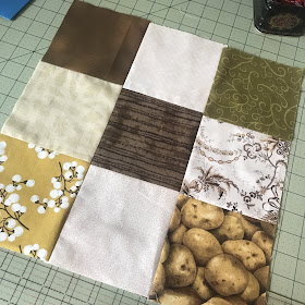 A disappearing nine patch with potato fabric