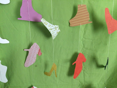 If you are throwing a spa party, a fashion party, a beauty party or any type of Girly Girl party, this DIY hanging shoe backdrop is the perfect statement piece.  It would make a great party photo backdrop or dessert table backdrop, and although it takes some time, it's totally easy and worth it!