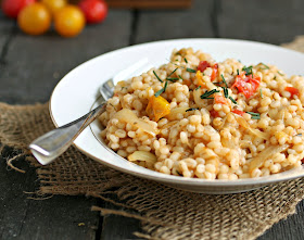 Recipe for fragrant, nutty barley as a wonderful side dish paired with sauteed onion and tomatoes.