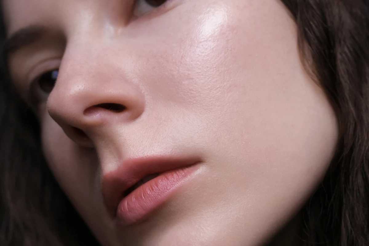 close-up portrait of woman's face with no makeup on it