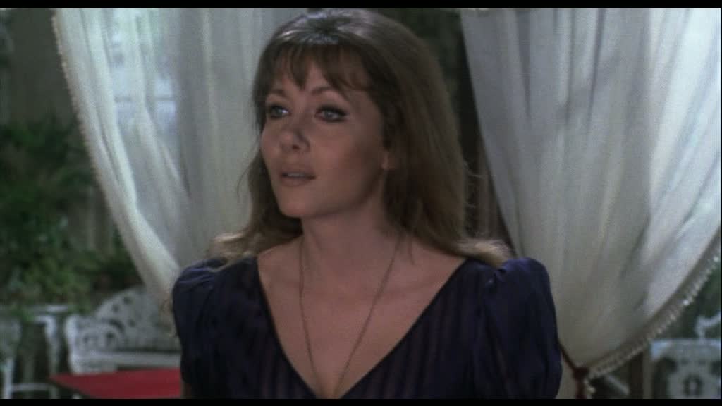 Now rewatching it for possibly the 10th time it's Madeline Smith who 