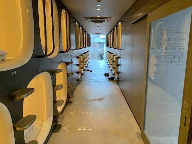 A row of sleeping pods by day