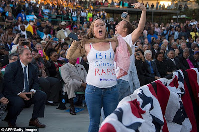 Bill 'rape' protesters interrupt President Obama but he heckles them back 