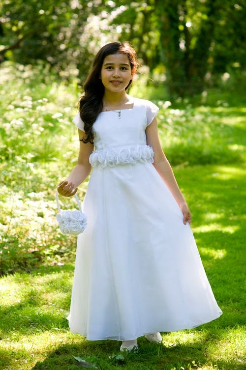 http://www.firstholycommunionday.co.uk/first-communion-dress---satin-and-organza-a---line-with-illusion-cap-sleeves-1117-p.asp