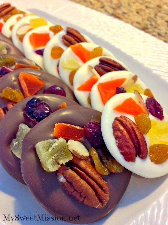 Chocolate mendiants are beautiful and delicious French confections composed of rich and creamy chocolate, studded with assorted dried fruits & nuts. They're so pretty, they almost look like stained glass windows!