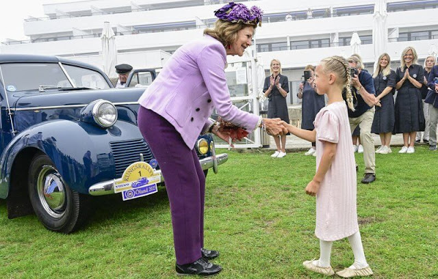 Queen Silvia wore a lilac blazer and silk blouse. Burgundy trousers. The Swedish Royal Vintage Rally
