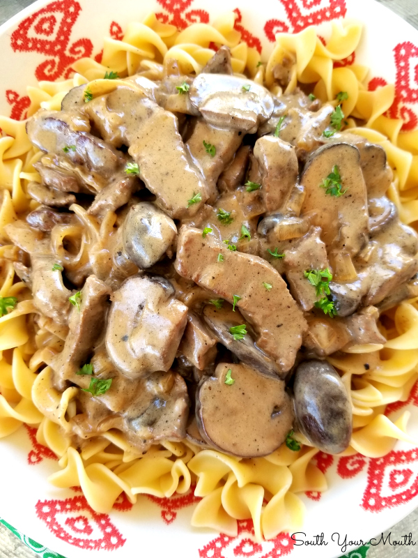 Classic Beef Stroganoff! An easy-to-follow recipe for classic Beef Stroganoff with tender strips of steak, sliced mushrooms and sauteed onions in a velvety sauce made with real sour cream.