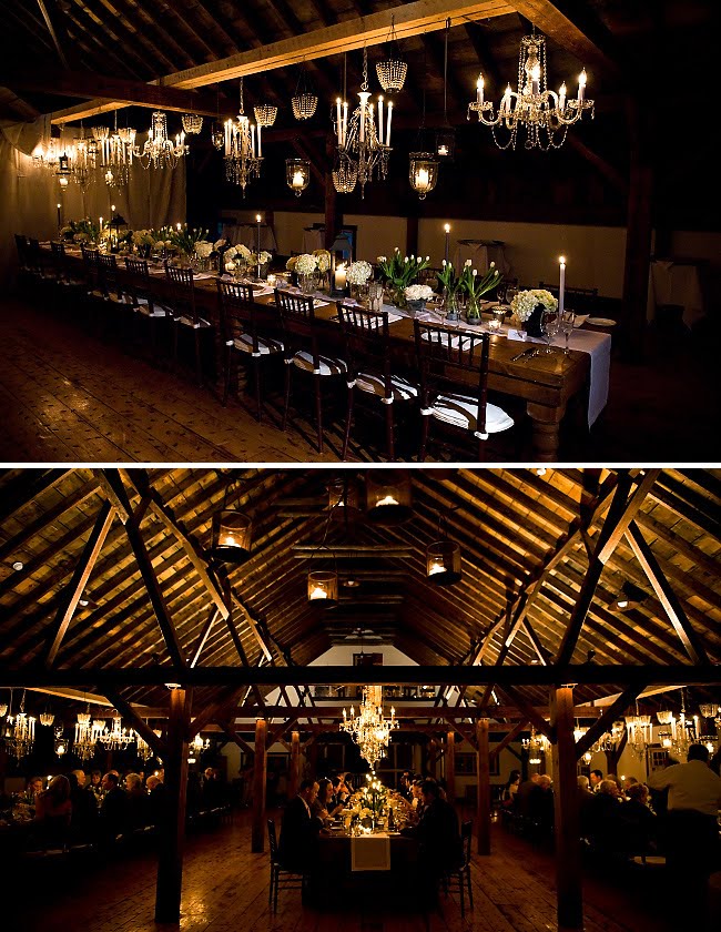 chandeliers hanging in rustic barn wedding photo booth fabric