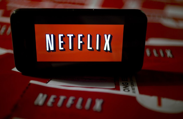 Netflix Logo projected on a device