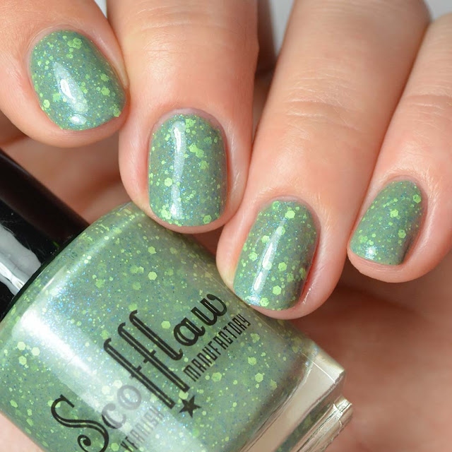 green nail polish with green and blue glitter