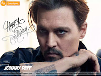 johnny depp birthday date greeting with his tattoo arm