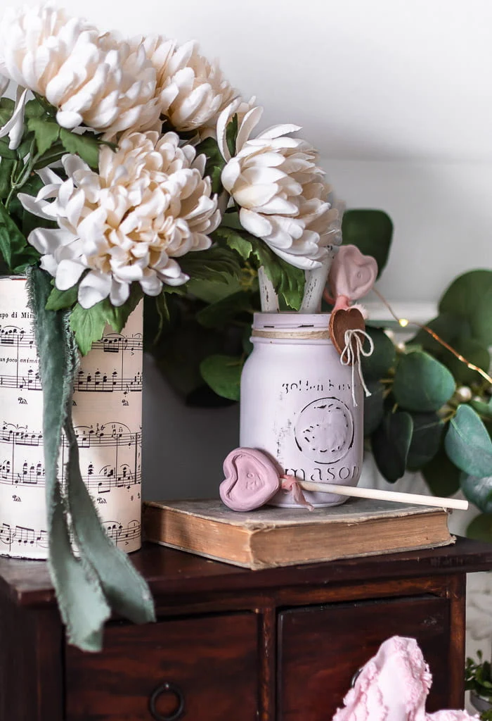 pink mason jar, vintage book, flowers