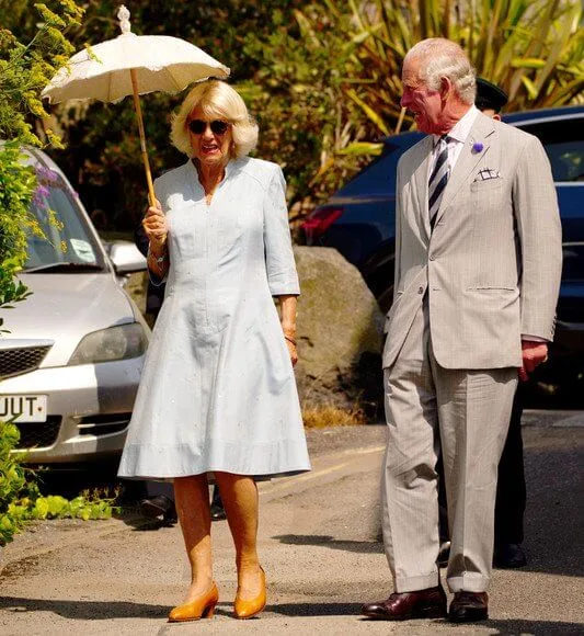 The Duchess of Cornwall wore a flower silhouette drawstring maxi dress from Me + Em