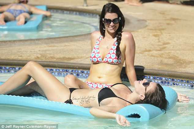  makes a bold statement in ink bikini as she shows off her new tattoo