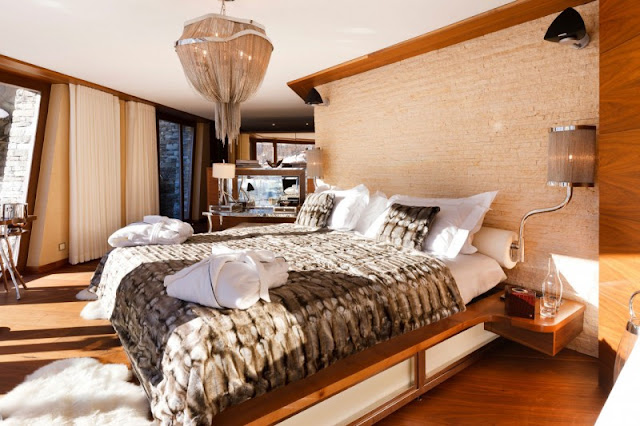 Picture of large bed in the bedroom of mountain home
