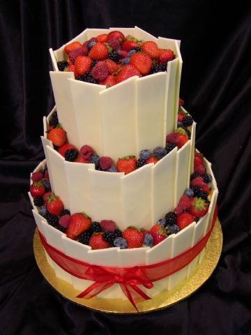 Three Tier White Chocolate Wedding Cake With Berries by Heidelberg Cakes