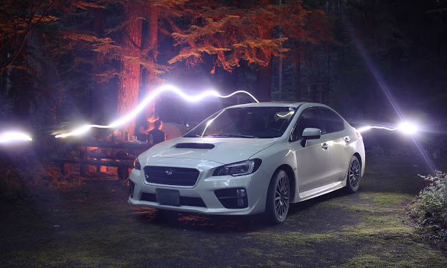 cool light effect using a DSLR Camera behind a White Subaru WRX 2015.