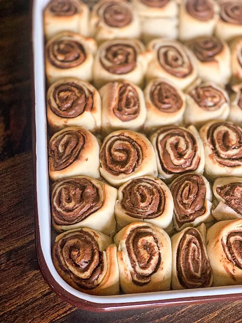 Nutella Sweet Rolls recipe follows a similar process to cinnamon rolls. They start with a soft, pillowy dough and are filled with the star of the recipe, Nutella, then iced with vanilla icing.