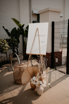 white welcome sign with boho decor