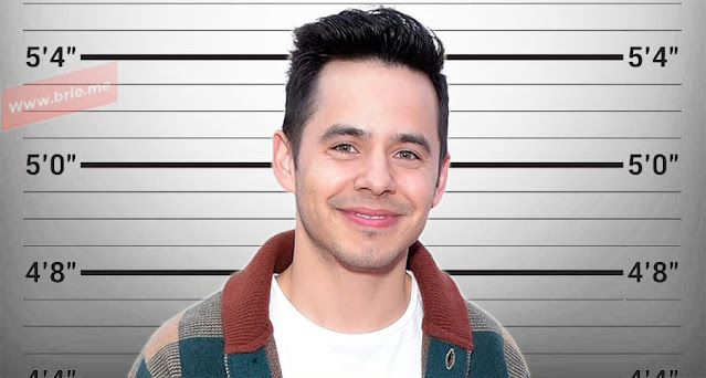 David Archuleta standing in front of a height chart