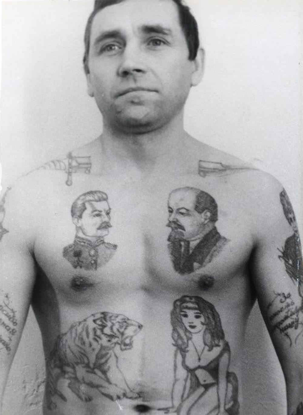 Text on the arm reads 'Thank you Dear Motherland for my ruined youth.' A dagger through the neck shows that a criminal has committed murder in prison and is available to hire for further killing. The drops of blood can signify the number of murders committed. Lenin is held by many criminals to be the chief 'pakhan' (boss) of the Communist Party. The letters BOP, which are sometimes tattooed under his image, carry a double meaning: The acronym stands for 'Leader of the October Revolution' but also spells the Russian word 'VOR' (thief).
