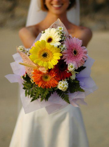  and orangey rusty red gerberas make up this stunning bridal bouquet