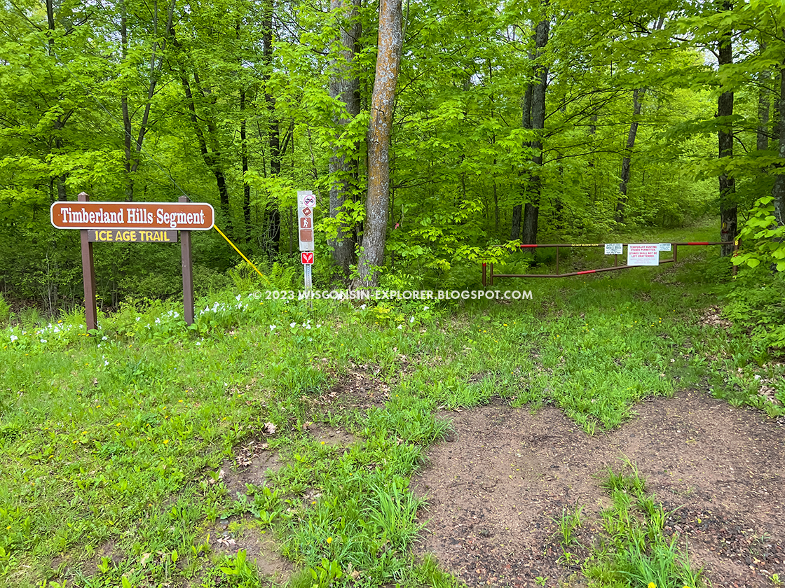 trail signs and a gate