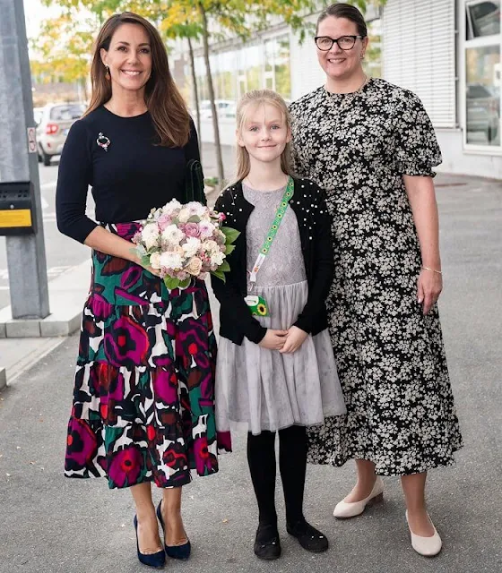 Princess Marie wore a new pond fuchsia floral print midi skirt by ba&sh, and black sweater by Boss