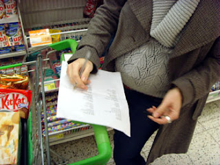 Me and bump checking off items on list - notice that we are in the 'chocolate' aisle