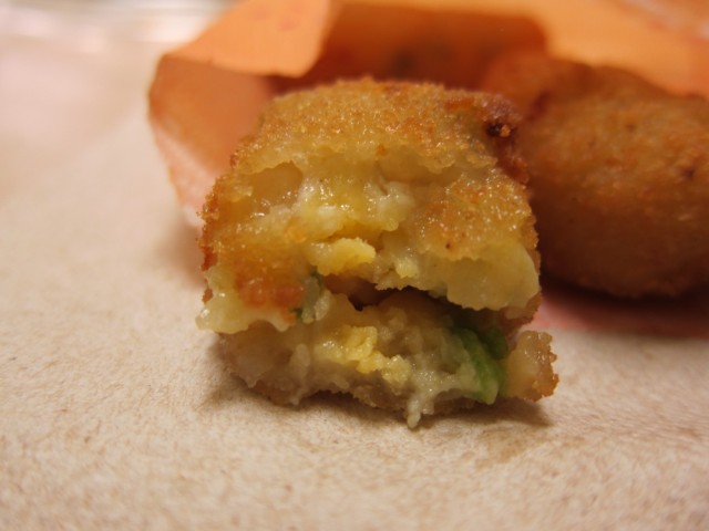 Cross-section of a Del Taco Cheesy Potato Popper.
