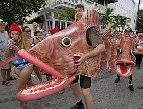 dressed as giant groupers, participate in the "Aquatic Afrolic"