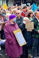 Anti-Tory posters at an #EnoughIsEnough rally