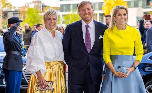 Queen Maxima, Princess Beatrix and Princess Laurentien attended the King's Day concert. Yellow top and gray blue skirt by Natan