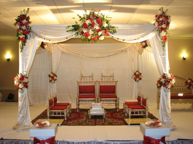 appealing-indian-aisle-in-red-and-white-colors-and-turkish-carpet-tropical-floral-bouquet-indoor-traditional-wedding-decor