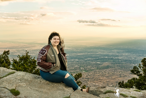 Professional senior photograph of a beautiful girl in the mountains