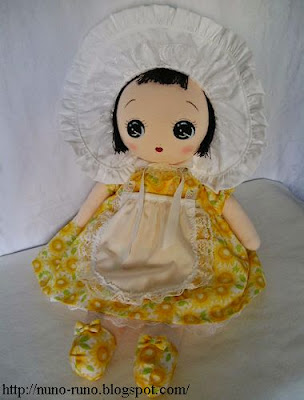 Bunka doll in yellow dress