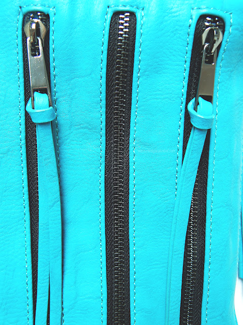Blue bag with three zippers