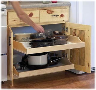 pull-out cabinet shelves holding pots and pans