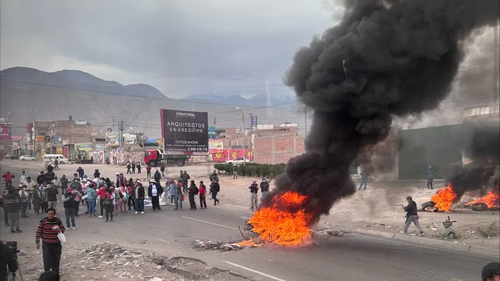 Protesters set fire to tires to blockade roads in Arequipa, Peru.