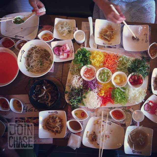 A table covered in dishes of Vietnamese food from Hoa Binh restaurant in South Korea.