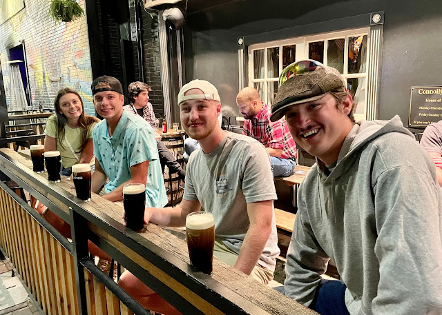 Some of the boys and Liz at a bar grabbing a drink.