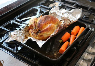 Adding carrots to the roasting dish